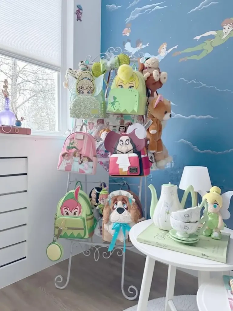 Freestanding metal rack displaying several colorful children’s backpacks vertically in a small room.