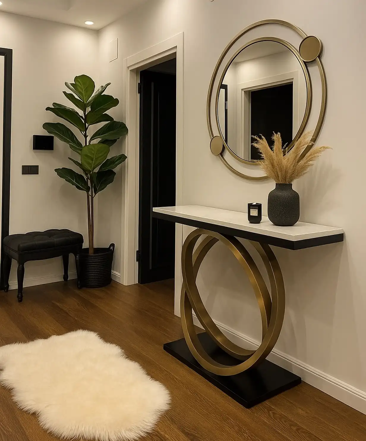 Modern hallway with gold and black console table, round mirror, black doors, dried branches, and leafy plant