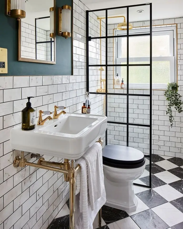 Black-and-white bathroom with diagonal checkerboard flooring, a console sink, teal walls, and a grid shower screen.