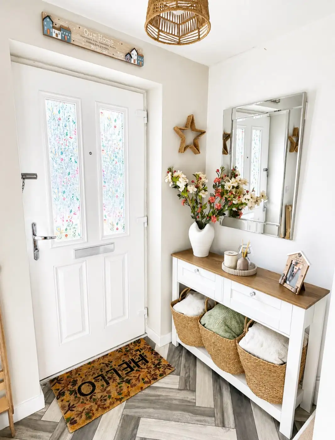 Slim entryway console table with drawers, woven storage baskets underneath, and round mirror