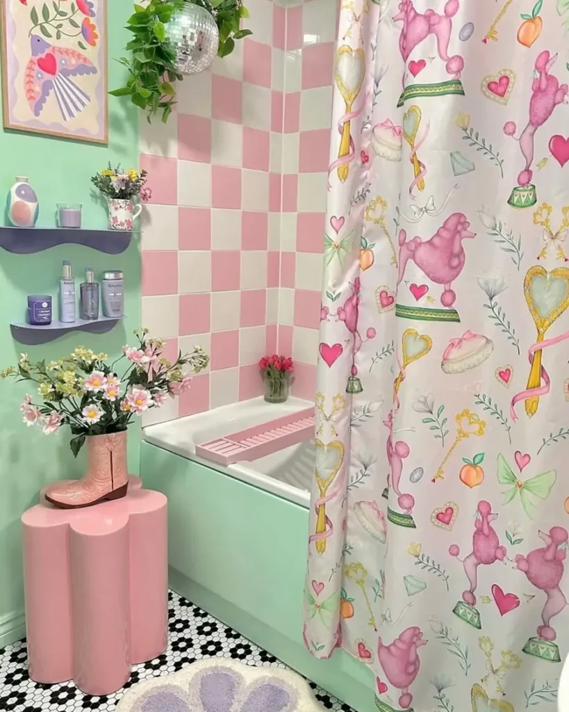 Mint and pink bathroom with a poodle shower curtain, checkerboard tiles, pink pedestal, and disco-ball planter.