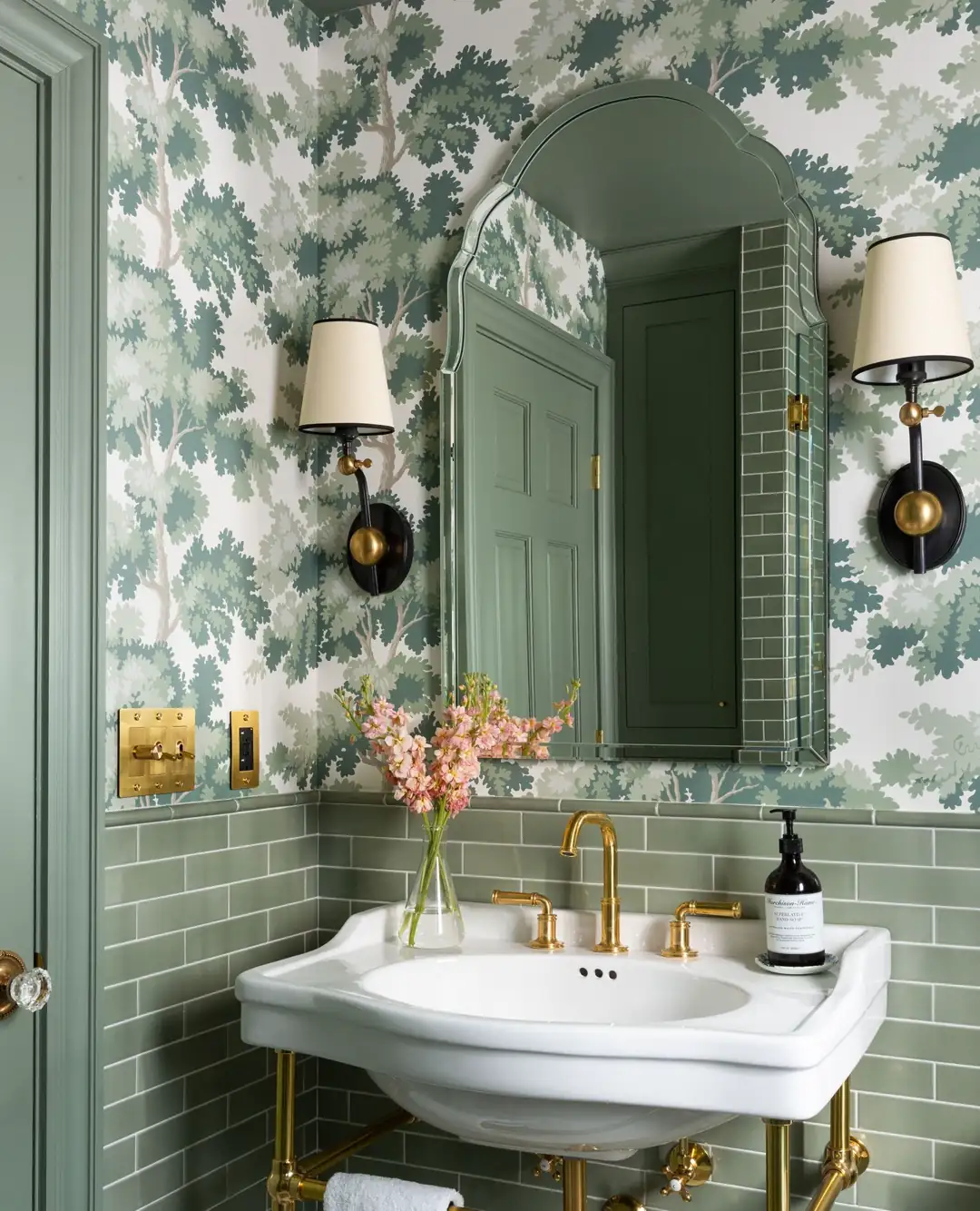 Calm sage green walk-in shower bathroom with vertical tile, wooden vanity, green vessel sink and black fixtures