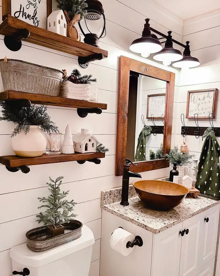 Modern farmhouse bathroom with white shiplap walls, rustic wood shelves, vessel sink, black pipe brackets, and farmhouse lighting