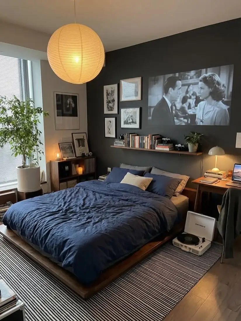 Moody bedroom with charcoal walls, deep navy bedding and warm wood bed frame