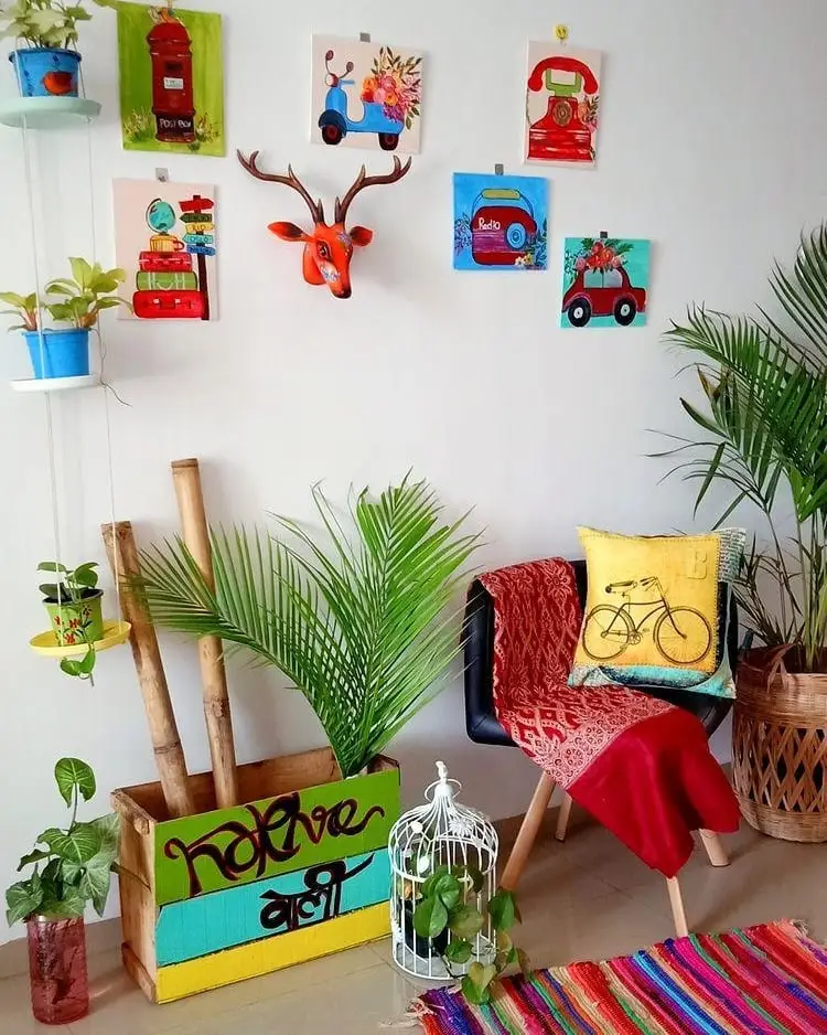 Bright eclectic living room corner with colorful wall art, plants, patterned rug, red throw, and accent chair