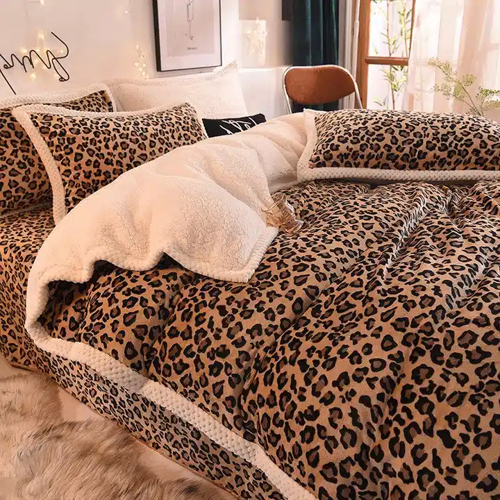 Leopard print bedding with thick cream sherpa trim and a soft cream bedside rug