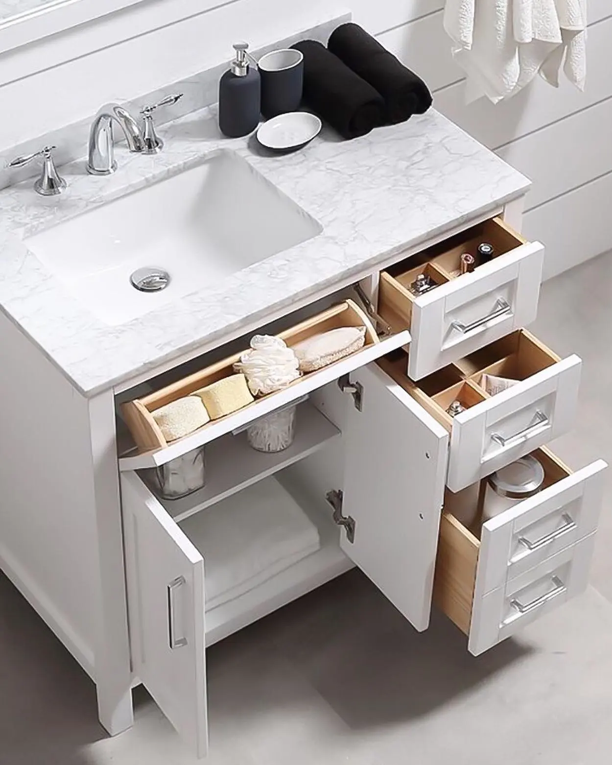 Bathroom vanity with shallow and narrow drawers organizing small toiletries around the sink and open cabinet storage below