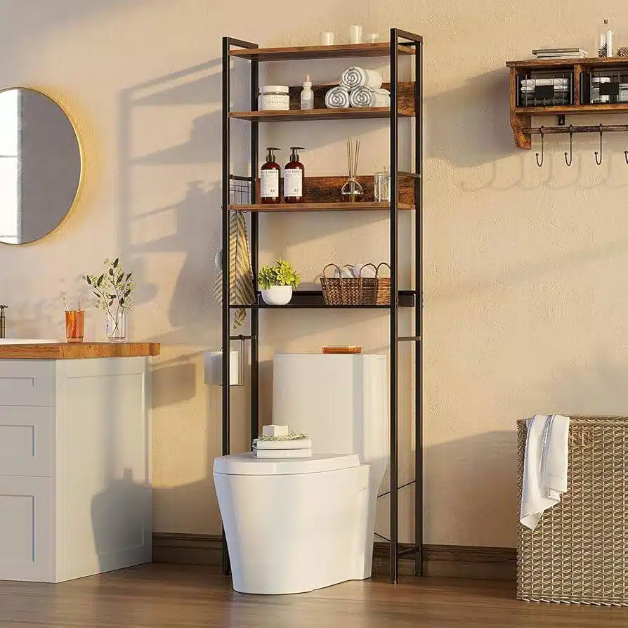 16 Black metal over-toilet shelving unit with wooden shelves, rolled towels, bottles, basket, and plants