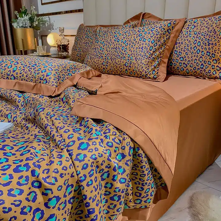 Blue and turquoise leopard print bedding paired with caramel brown sheets