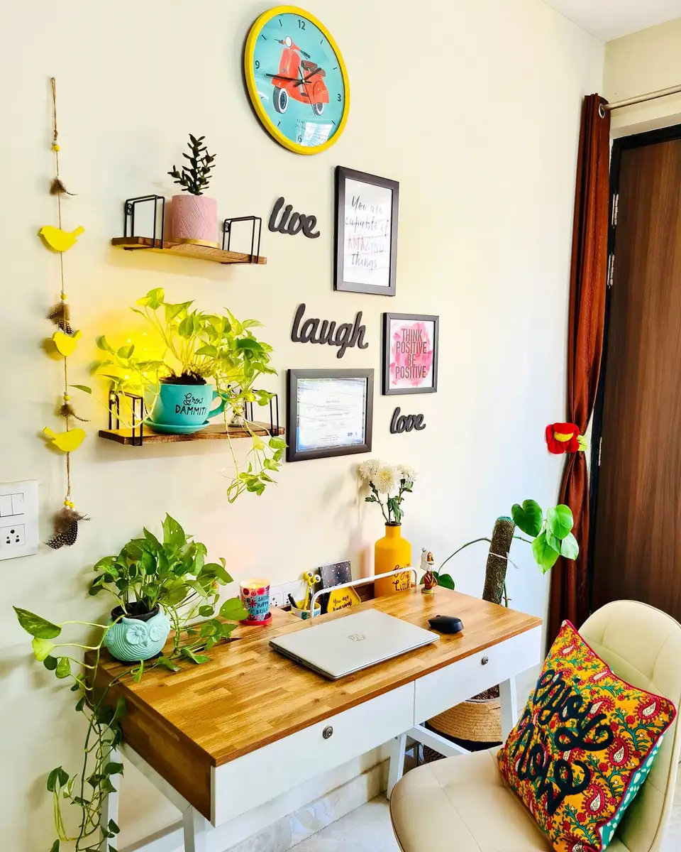 Plant-filled homework desk with laptop, wall shelves, drawers, books, and greenery around the edges