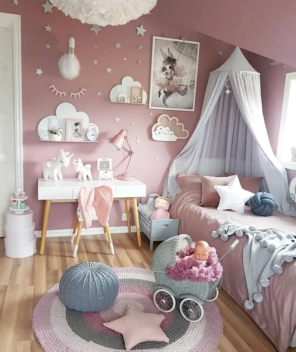 Dusty pink girls bedroom with grey canopy, cloud shelves, white stars, desk, and soft grey accents