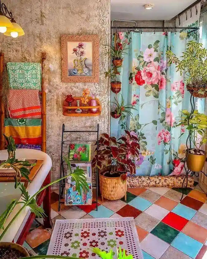 Boho bathroom with floral shower curtain, mixed tile floor, woven baskets, and many green plants