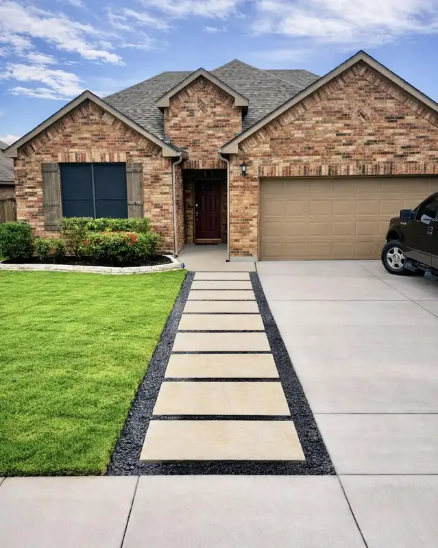Wide driveway with a separate narrow pedestrian path made from large rectangular paving slabs