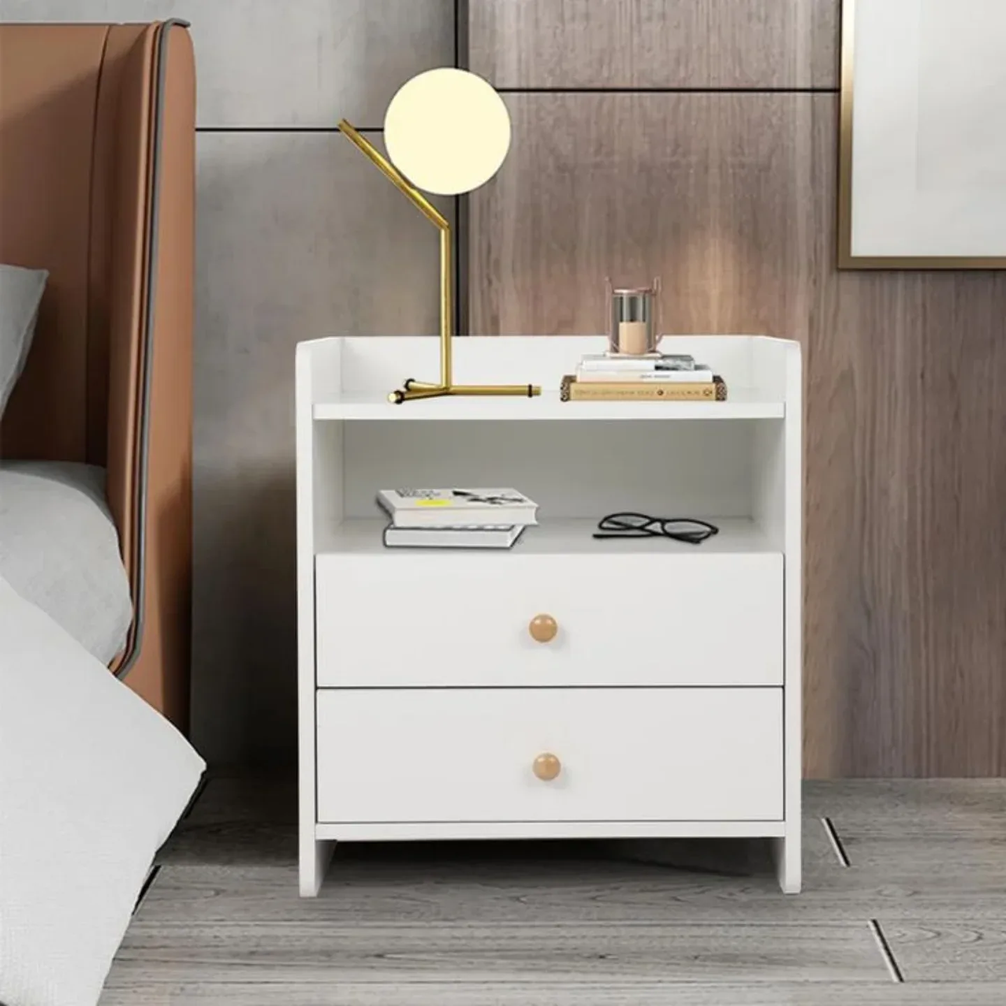 Wood nightstand with globe lamp, open shelf, books, glasses, candle, and drawer storage