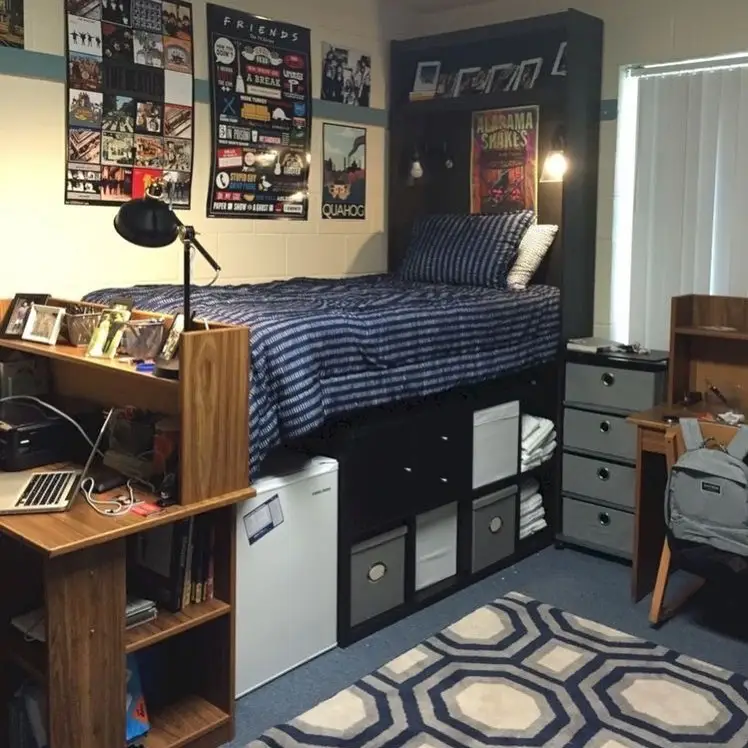 Raised bed with open storage cubbies underneath and compact desk with nearby shelving