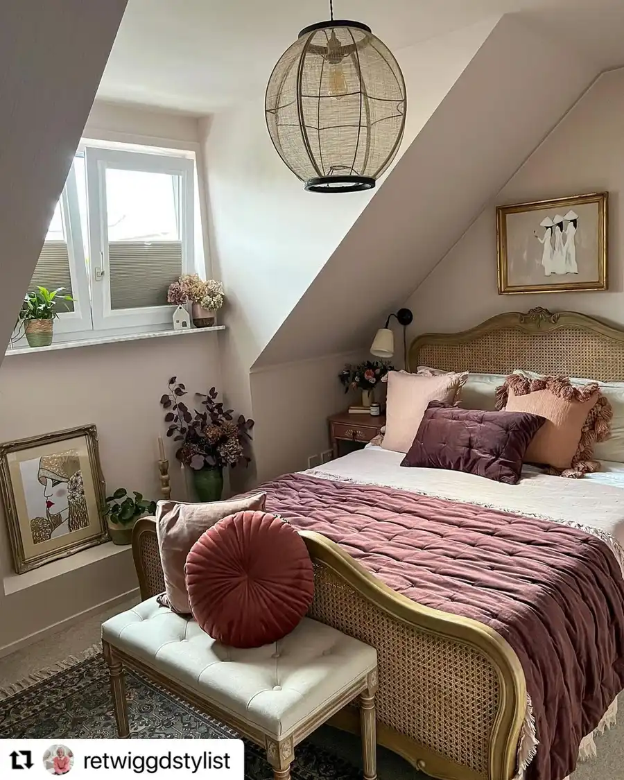 Attic bedroom with sloped ceiling, low bed, bench and dusty rose bedding