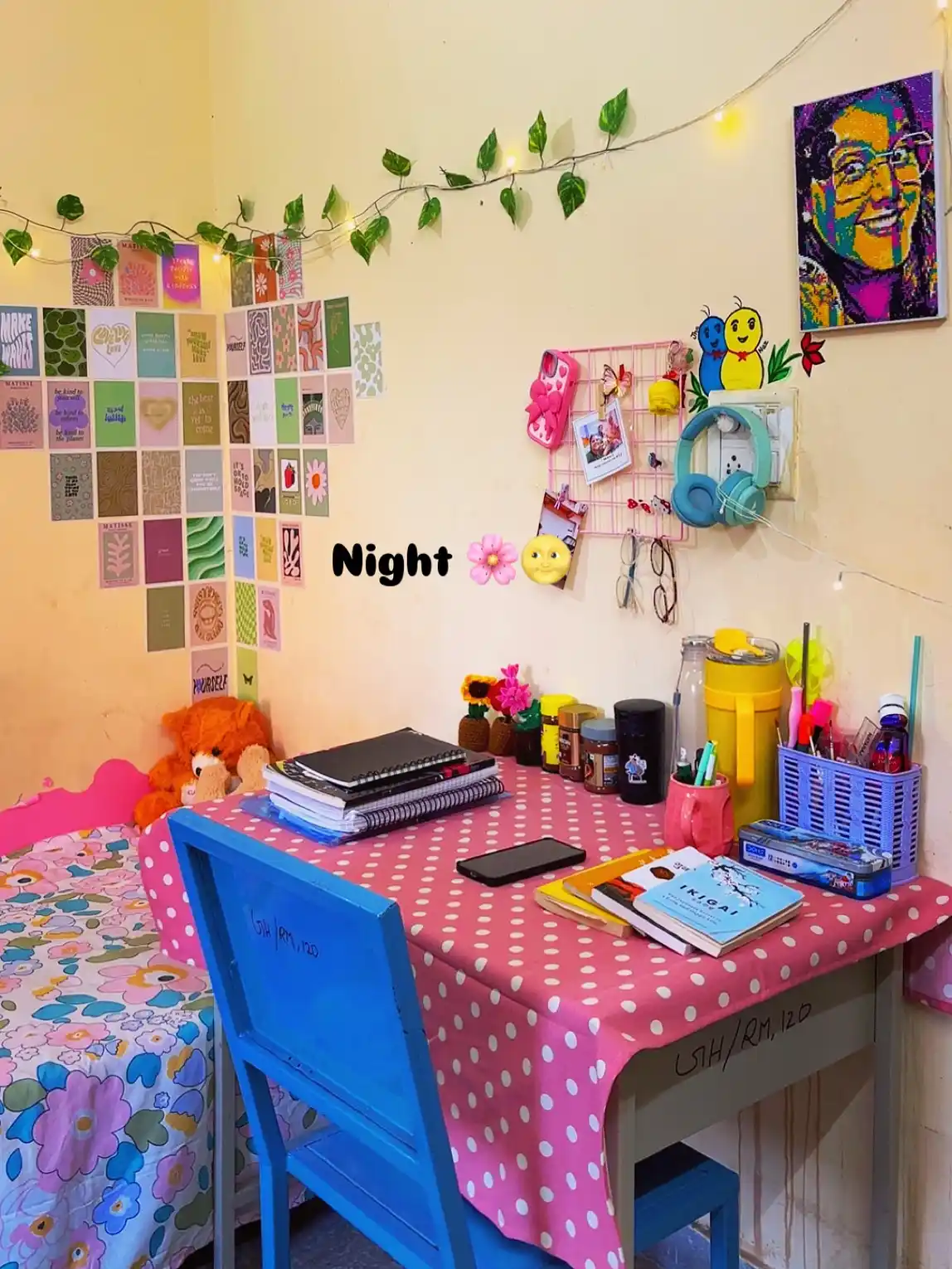 Colorful dorm desk with bright stationery, wall cards, leafy garland, and playful accessories